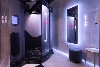 Black glo tanning spray tan booth.