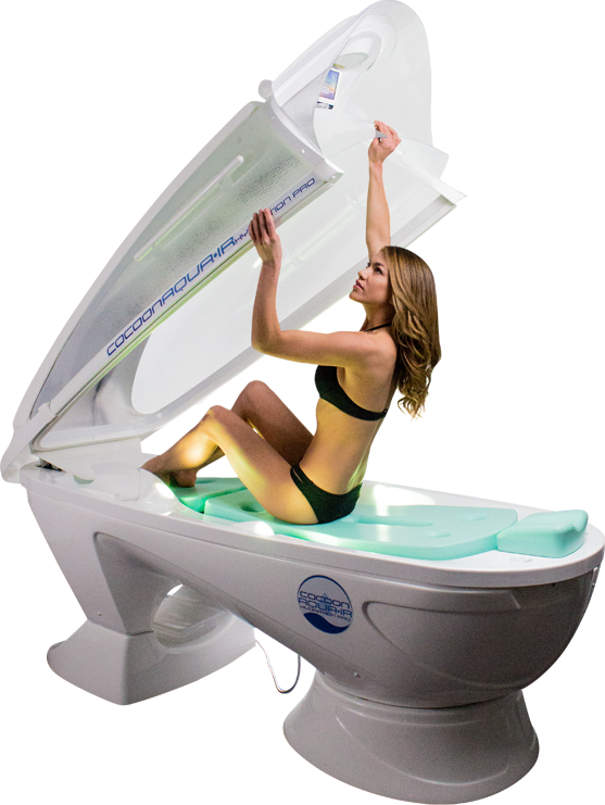 Woman about to lay down in a aqua ir bed.