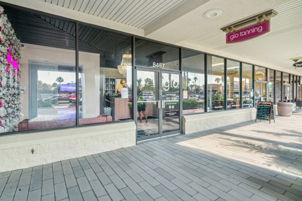 Front door of a glo tanning store.