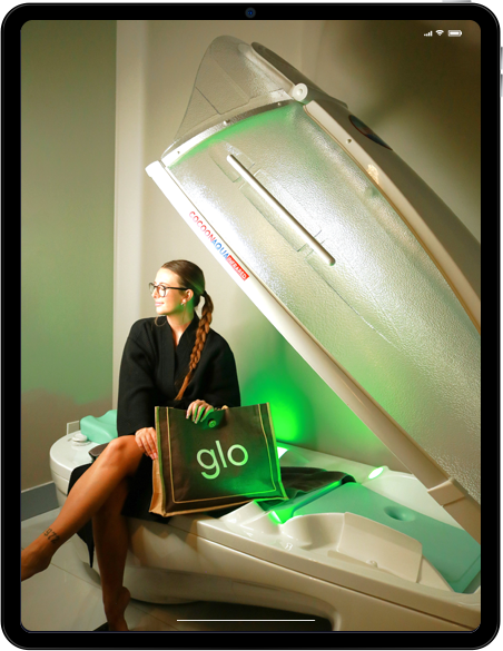 Woman with braid sitting inside a spa booth.