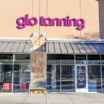 Front view of a glo tanning saloon entrance.