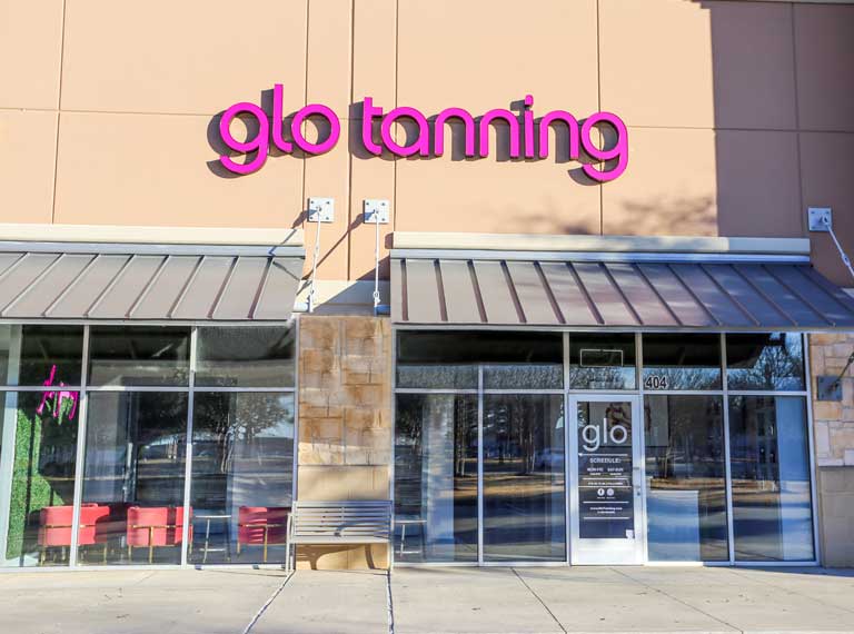 Front view of a glo tanning saloon entrance.